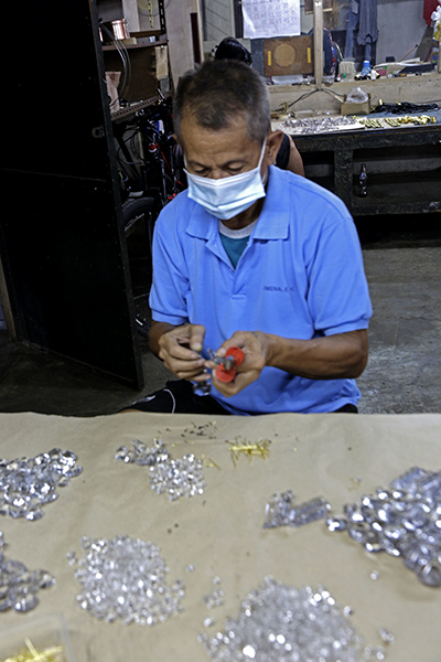 chandelier crystals being strung together